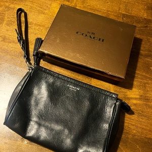 Coach black leather wristlet . Like new .